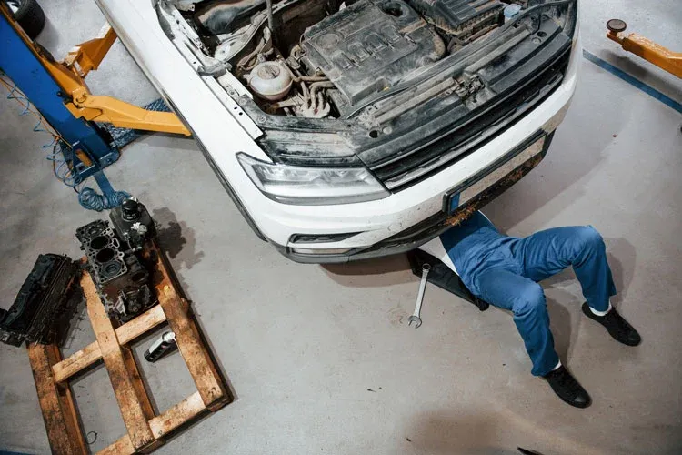 repairing a car in an auto repair shop in tucson